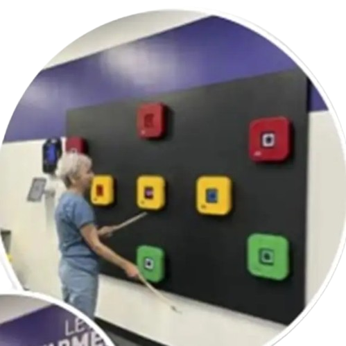 Person tapping colorful therapy wall