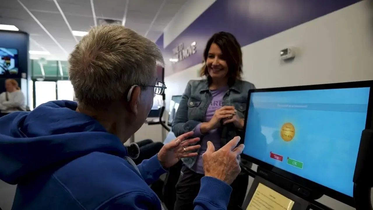 Person using fitness touchscreen monitor